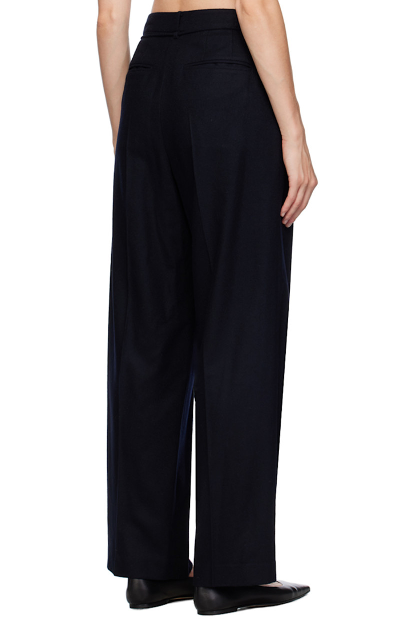 Straight-leg wool-blend flannel trousers.

· Belt loops 
· Drawstring at waist
· Four-pocket styling
· Zip-fly
· Pleats at front
· Creased legs 
· Partial satin lining

Supplier color: Navy
