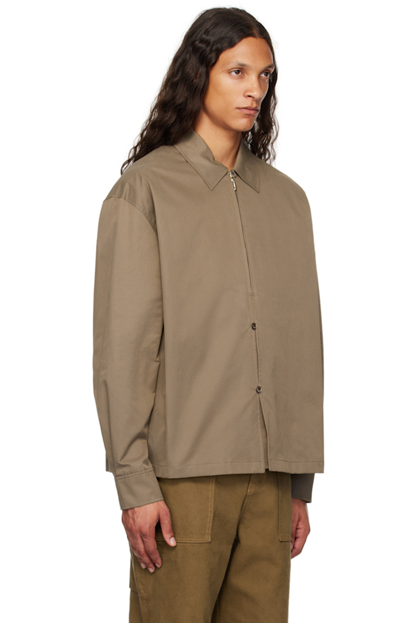 Cotton-blend twill shirt.

· Spread collar
· Half-zip and button closure
· Dropped shoulders
· Single-button barrel cuffs
· Locker loop and twin pleats at back yoke

Supplier color: Brown