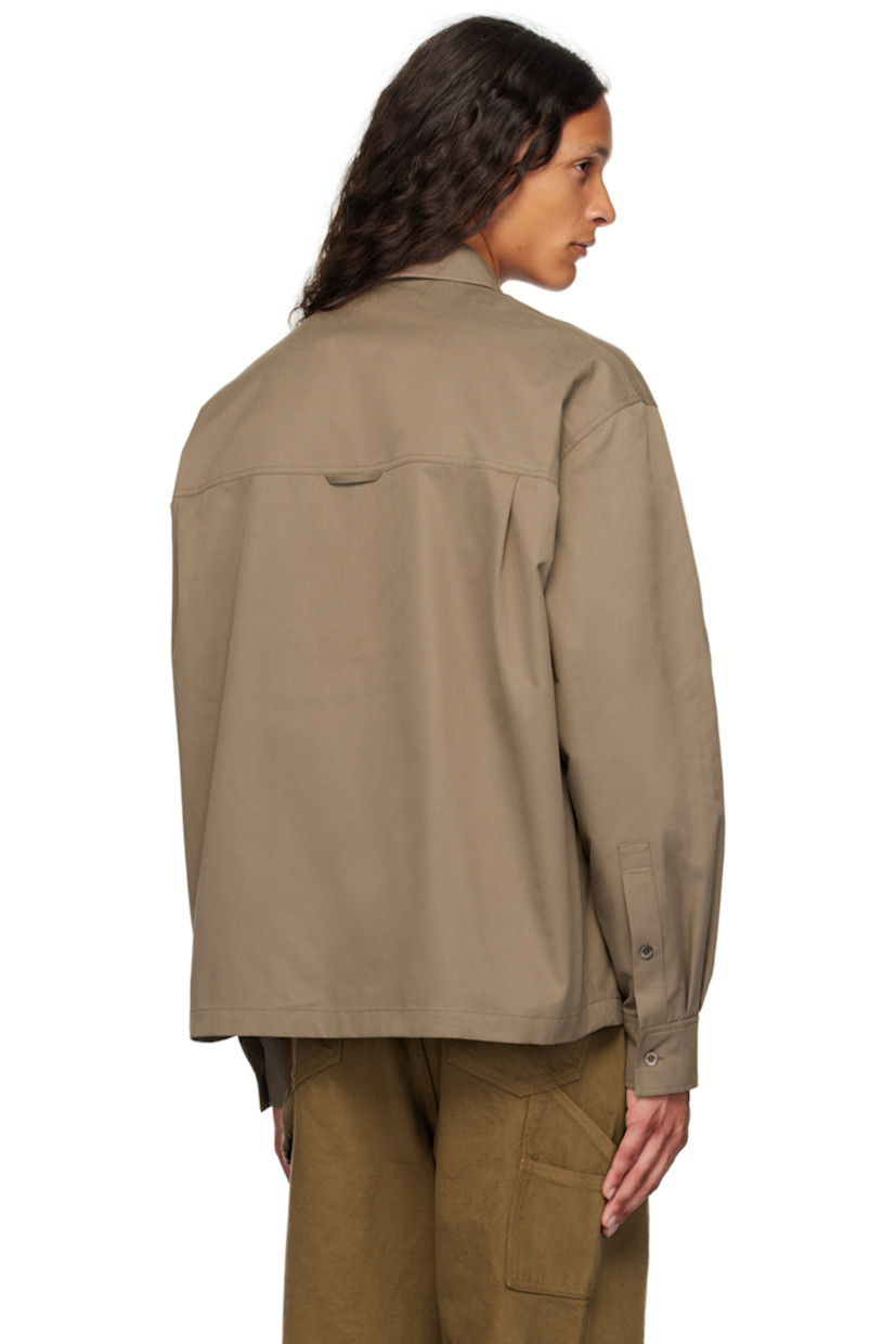 Cotton-blend twill shirt.

· Spread collar
· Half-zip and button closure
· Dropped shoulders
· Single-button barrel cuffs
· Locker loop and twin pleats at back yoke

Supplier color: Brown