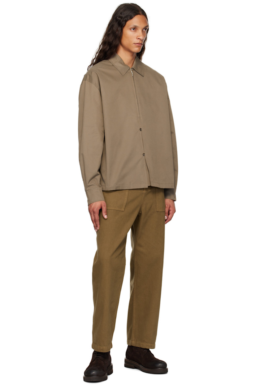 Cotton-blend twill shirt.

· Spread collar
· Half-zip and button closure
· Dropped shoulders
· Single-button barrel cuffs
· Locker loop and twin pleats at back yoke

Supplier color: Brown