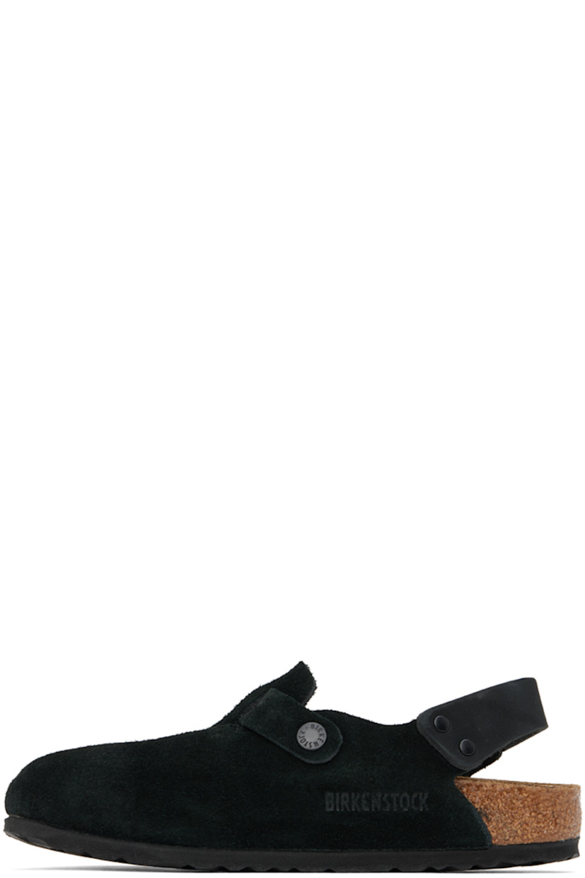 Suede slip-on loafers in black.

· Pin-buckle strap at vamp
· Pin-buckle slingback strap
· Logo embossed at inner side
· Logo embossed at molded suede footbed
· Cork-latex midsole
· Treaded EVA sole
· Logo-engraved black hardware

Supplier color: Black