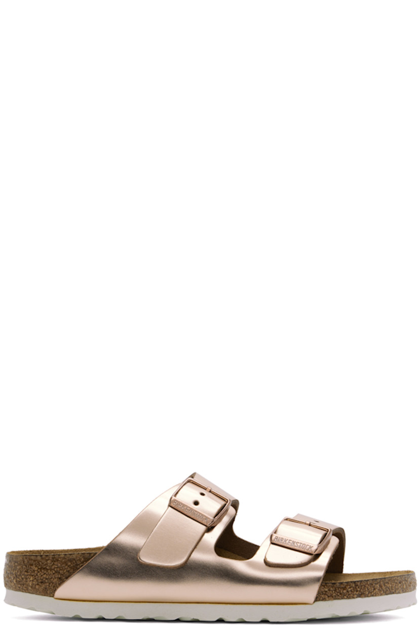 Buffed leather slip-on flat sandals in metallic copper tone.

· Open toe
· Pin-buckle straps at vamp
· Logo embossed at inner side
· Logo printed at cushioned molded suede footbed
· Cork-latex midsole
· Treaded EVA rubber sole
· Logo-engraved antiqued copper-tone hardware

Supplier color: Metallic copper