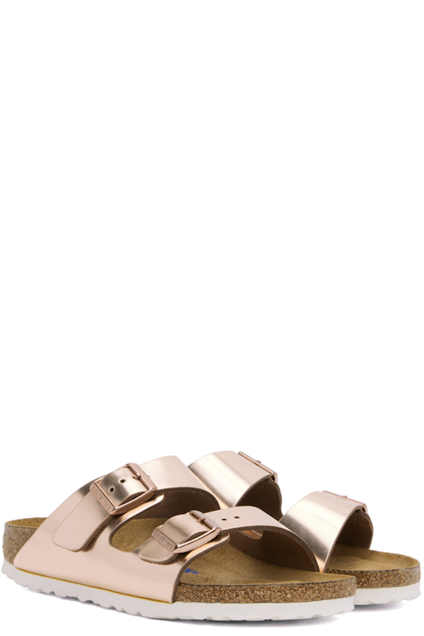 Buffed leather slip-on flat sandals in metallic copper tone.

· Open toe
· Pin-buckle straps at vamp
· Logo embossed at inner side
· Logo printed at cushioned molded suede footbed
· Cork-latex midsole
· Treaded EVA rubber sole
· Logo-engraved antiqued copper-tone hardware

Supplier color: Metallic copper