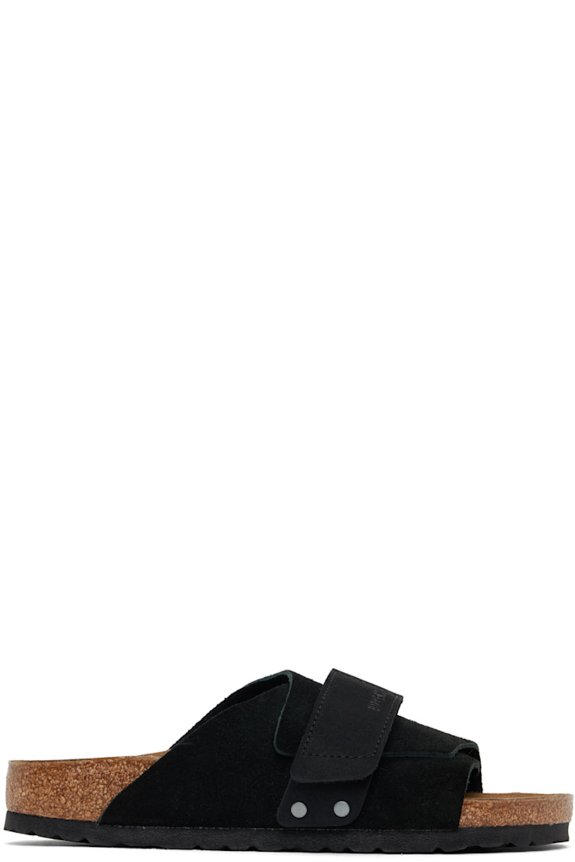 Suede and nubuck slip-on flat sandals in black.

· Open toe
· Velcro strap at vamp 
· Logo embossed at vamp and inner side
· Logo printed at molded suede footbed
· Latex-cork midsole
· Treaded EVA rubber sole

Supplier color: Black