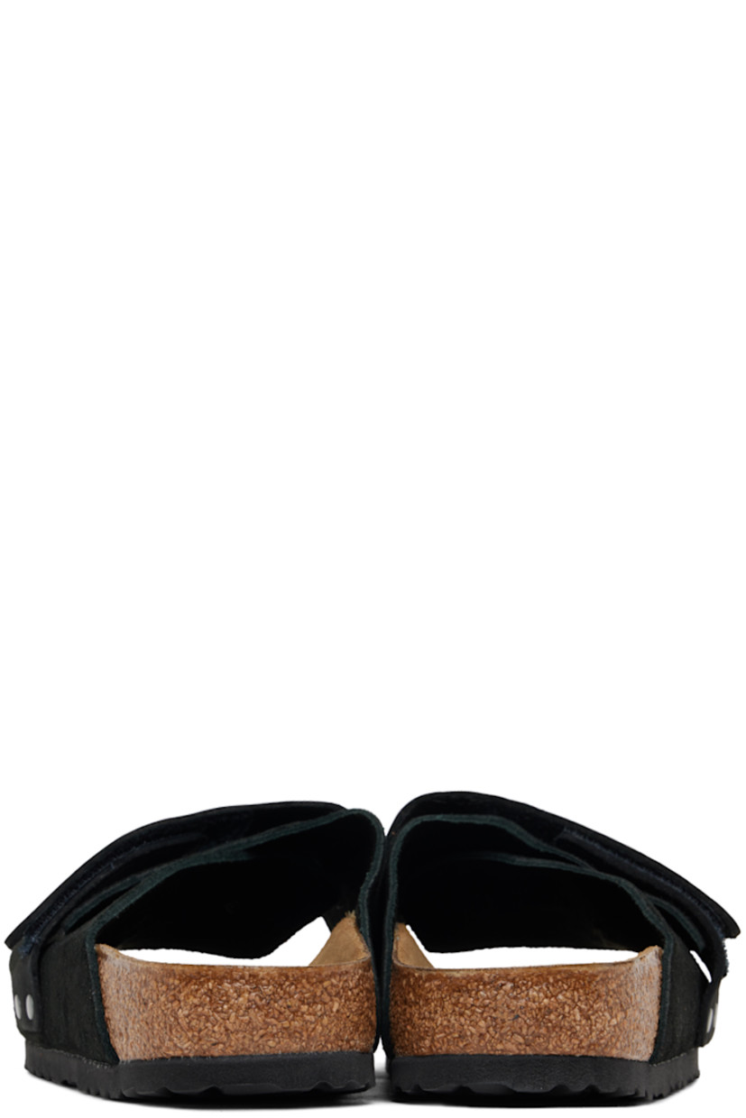 Suede and nubuck slip-on flat sandals in black.

· Open toe
· Velcro strap at vamp 
· Logo embossed at vamp and inner side
· Logo printed at molded suede footbed
· Latex-cork midsole
· Treaded EVA rubber sole

Supplier color: Black