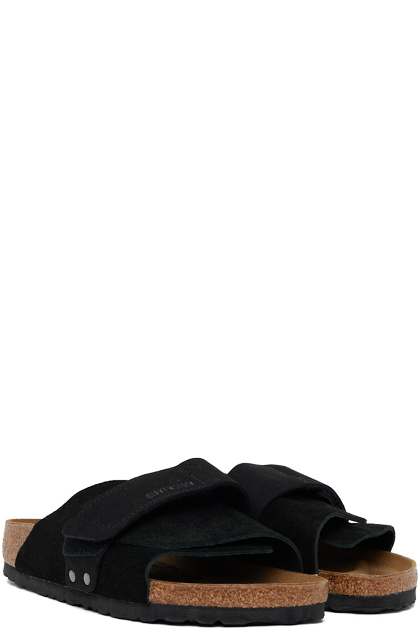 Suede and nubuck slip-on flat sandals in black.

· Open toe
· Velcro strap at vamp 
· Logo embossed at vamp and inner side
· Logo printed at molded suede footbed
· Latex-cork midsole
· Treaded EVA rubber sole

Supplier color: Black