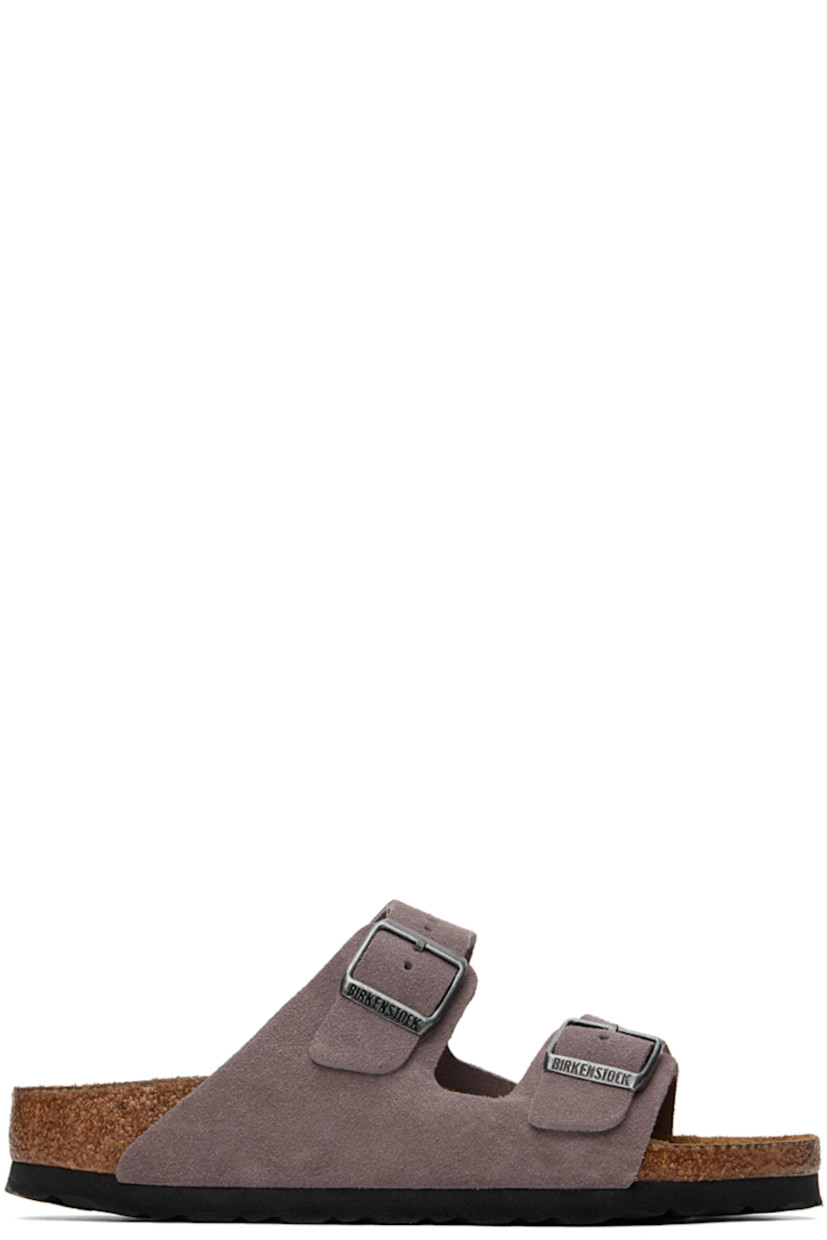 Suede slip-on sandals in purple. 

· Open toe
· Pin-buckle straps at vamp
· Logo embossed at inner side
· Logo stamp at molded suede footbed
· Cork midsole
· Treaded EVA rubber sole
· Logo-engraved antiqued silver-tone hardware

Supplier color: Faded purple