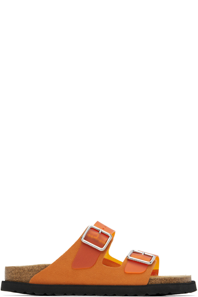 Nubuck and PVC slip-on sandals in orange.

· Open toe
· Pin-buckle straps at vamp
· Logo embossed at inner side
· Logo stamp at molded suede footbed
· Cork midsole
· Treaded EVA rubber sole

Supplier color: Vibrant orange