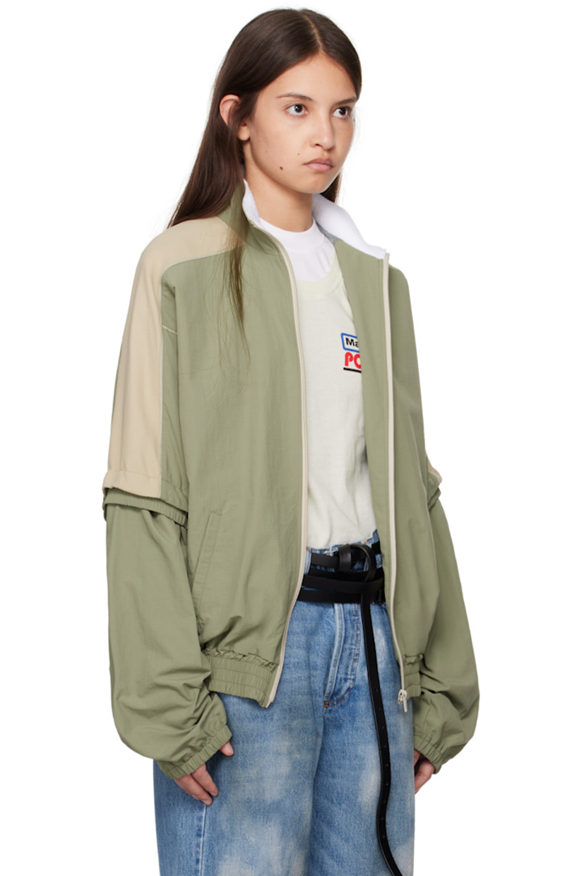 Nylon canvas and viscose-blend cady jacket.

· Fleece trim at mock neck
· Zip closure
· Welt pockets
· Elasticized hem and cuffs
· Logo printed at shoulder 
· Raglan sleeves
· Detachable panel at sleeves
· Bungee-style drawstring at back
· Mesh lining

Supplier color: Sage
