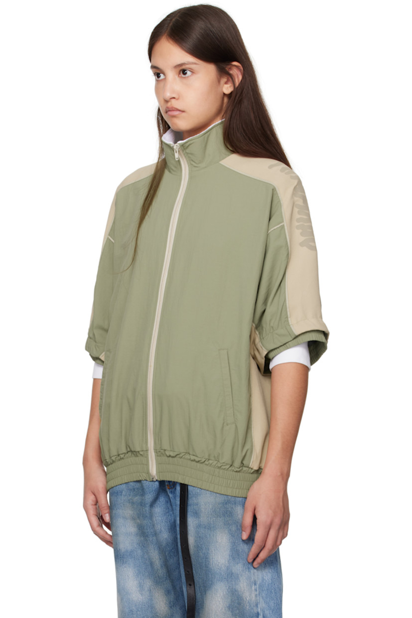 Nylon canvas and viscose-blend cady jacket.

· Fleece trim at mock neck
· Zip closure
· Welt pockets
· Elasticized hem and cuffs
· Logo printed at shoulder 
· Raglan sleeves
· Detachable panel at sleeves
· Bungee-style drawstring at back
· Mesh lining

Supplier color: Sage