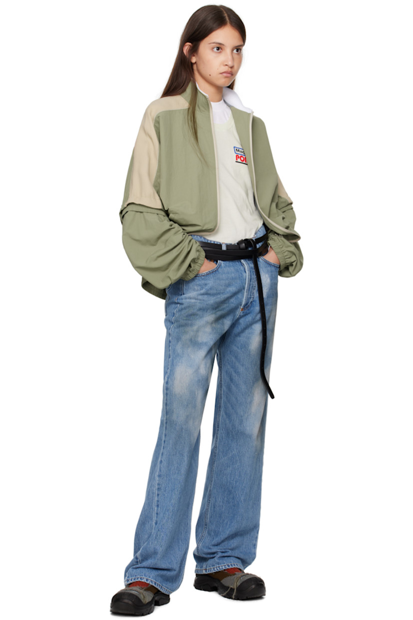 Nylon canvas and viscose-blend cady jacket.

· Fleece trim at mock neck
· Zip closure
· Welt pockets
· Elasticized hem and cuffs
· Logo printed at shoulder 
· Raglan sleeves
· Detachable panel at sleeves
· Bungee-style drawstring at back
· Mesh lining

Supplier color: Sage