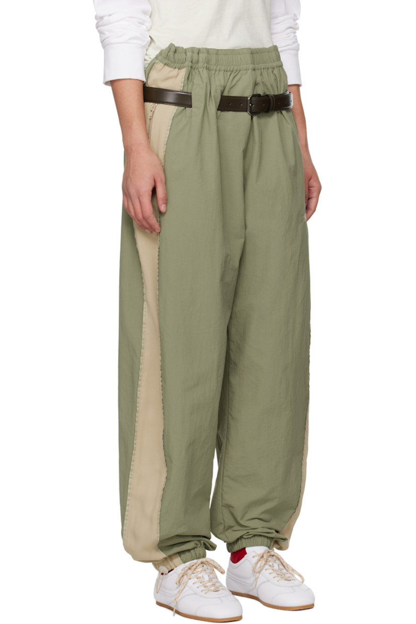 Nylon canvas and viscose-blend cady track pants.

· Paneled construction
· Concealed drawstring at elasticized waistband
· Cutout at waistband
· Detachable leather pin-buckle belt
· Two-pocket styling
· Logo embroidered at front
· Bungee-style drawstring at cuffs
· Silver-tone hardware

Supplier color: Sage