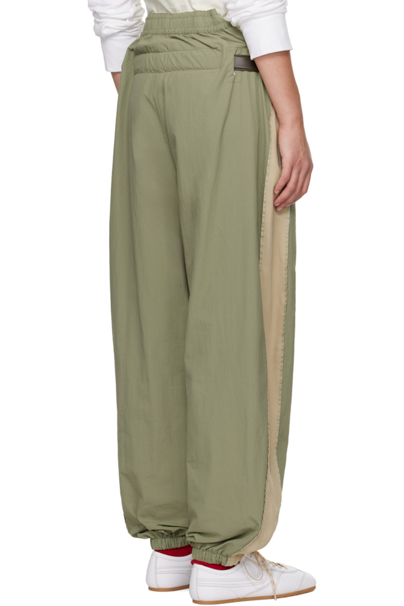 Nylon canvas and viscose-blend cady track pants.

· Paneled construction
· Concealed drawstring at elasticized waistband
· Cutout at waistband
· Detachable leather pin-buckle belt
· Two-pocket styling
· Logo embroidered at front
· Bungee-style drawstring at cuffs
· Silver-tone hardware

Supplier color: Sage