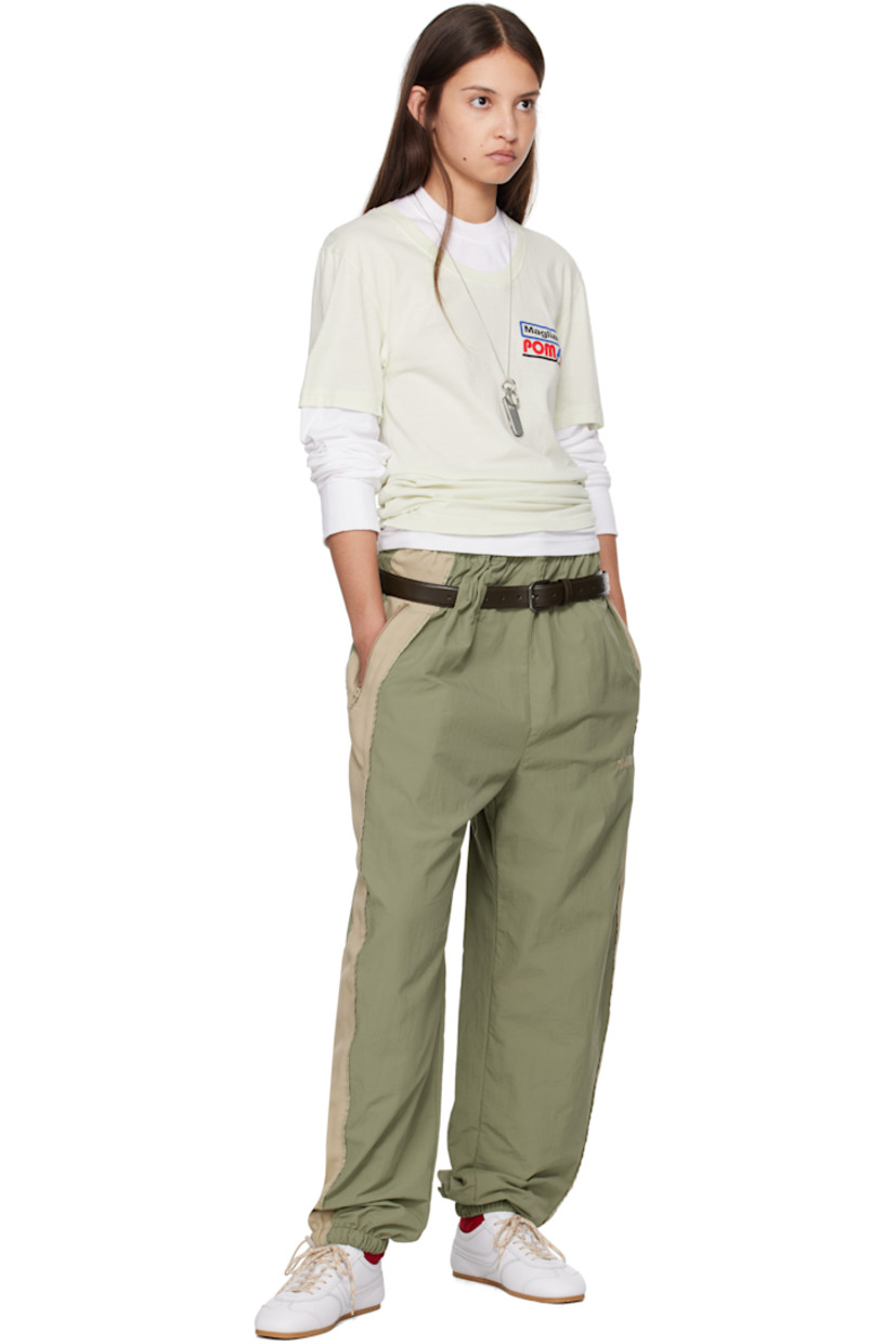 Nylon canvas and viscose-blend cady track pants.

· Paneled construction
· Concealed drawstring at elasticized waistband
· Cutout at waistband
· Detachable leather pin-buckle belt
· Two-pocket styling
· Logo embroidered at front
· Bungee-style drawstring at cuffs
· Silver-tone hardware

Supplier color: Sage