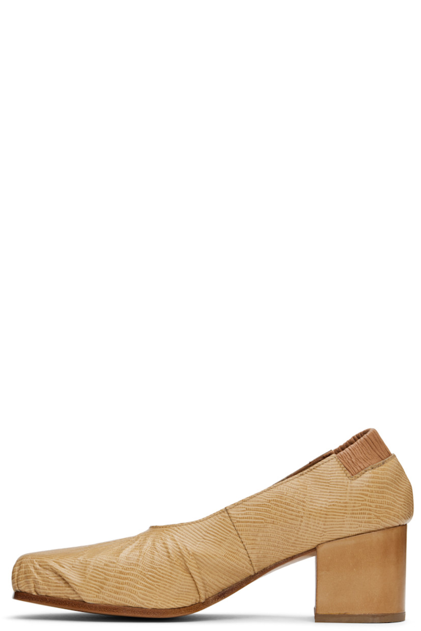 Lizard-embossed leather heels in beige.

· Gathering at square toe and vamp
· Elasticized heel collar
· Suede and buffed leather lining
· Block heel with rubber injection
· Leather sole
· Heel: H2.25"

Supplier color: Beige