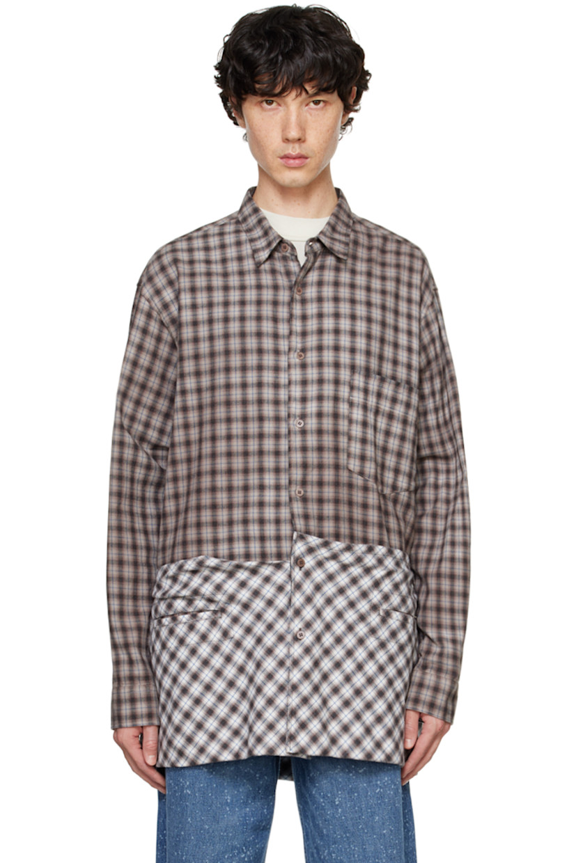 Overdyed cotton flannel shirt. Check pattern throughout.

· Spread collar
· Button closure
· Patch pocket at chest
· Welt pockets
· Drawstring and patch pockets at hem
· Pleats at single-button barrel cuffs
· Box pleat at back yoke

Supplier color: Brown check