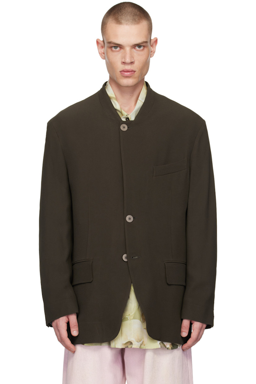 Acetate- and viscose-blend twill blazer.

· Stand collar
· Button closure
· Welt pocket and flap pockets
· Darts at waist
· Padded shoulders
· Three-button surgeons cuffs
· Patch pocket at interior
· Full cotton jersey lining

Supplier color: Brown