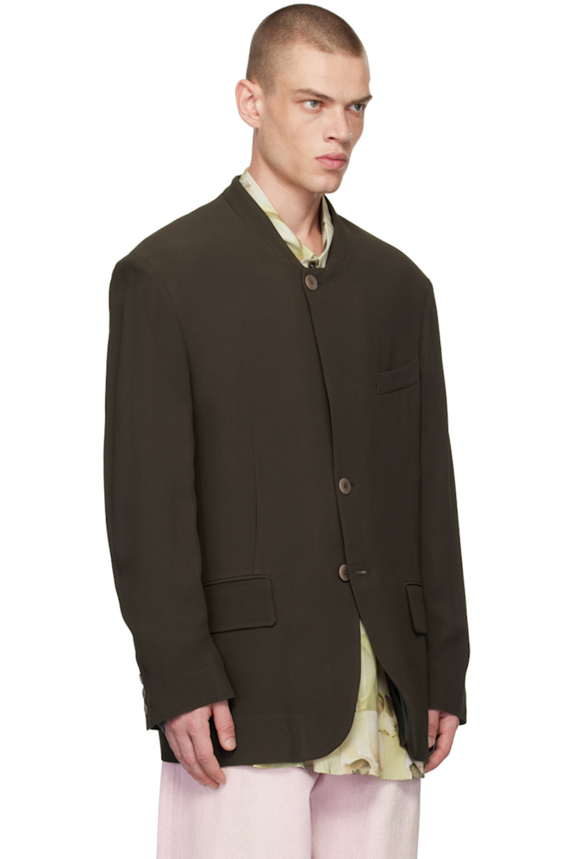 Acetate- and viscose-blend twill blazer.

· Stand collar
· Button closure
· Welt pocket and flap pockets
· Darts at waist
· Padded shoulders
· Three-button surgeons cuffs
· Patch pocket at interior
· Full cotton jersey lining

Supplier color: Brown