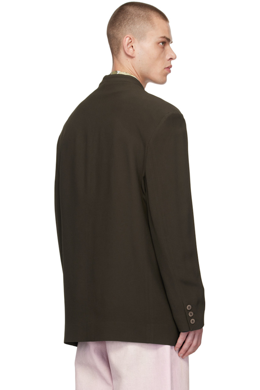 Acetate- and viscose-blend twill blazer.

· Stand collar
· Button closure
· Welt pocket and flap pockets
· Darts at waist
· Padded shoulders
· Three-button surgeons cuffs
· Patch pocket at interior
· Full cotton jersey lining

Supplier color: Brown