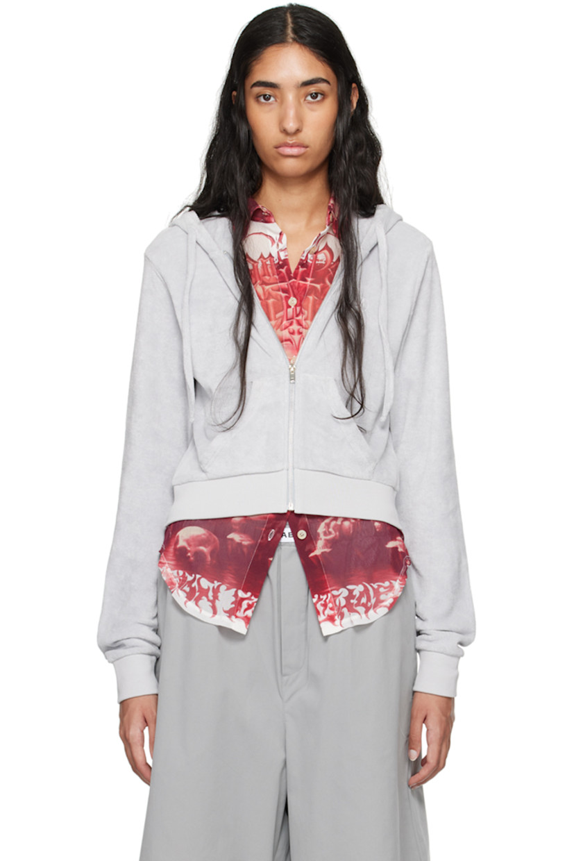 Organic cotton terrycloth hoodie. 

· Drawstring at hood
· Zip closure
· Logo embroidered at chest
· Welt pockets
· Rib knit cropped hem and cuffs

Supplier color: Grey