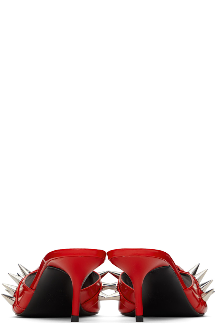 Polished leather heeled sandals in red.

· Open toe
· Spikes and graphic hardware at vamp
· Logo embossed at padded footbed
· Covered kitten heel with rubber injection
· Leather sole
· Heel: H2.5"

Supplier color: Red