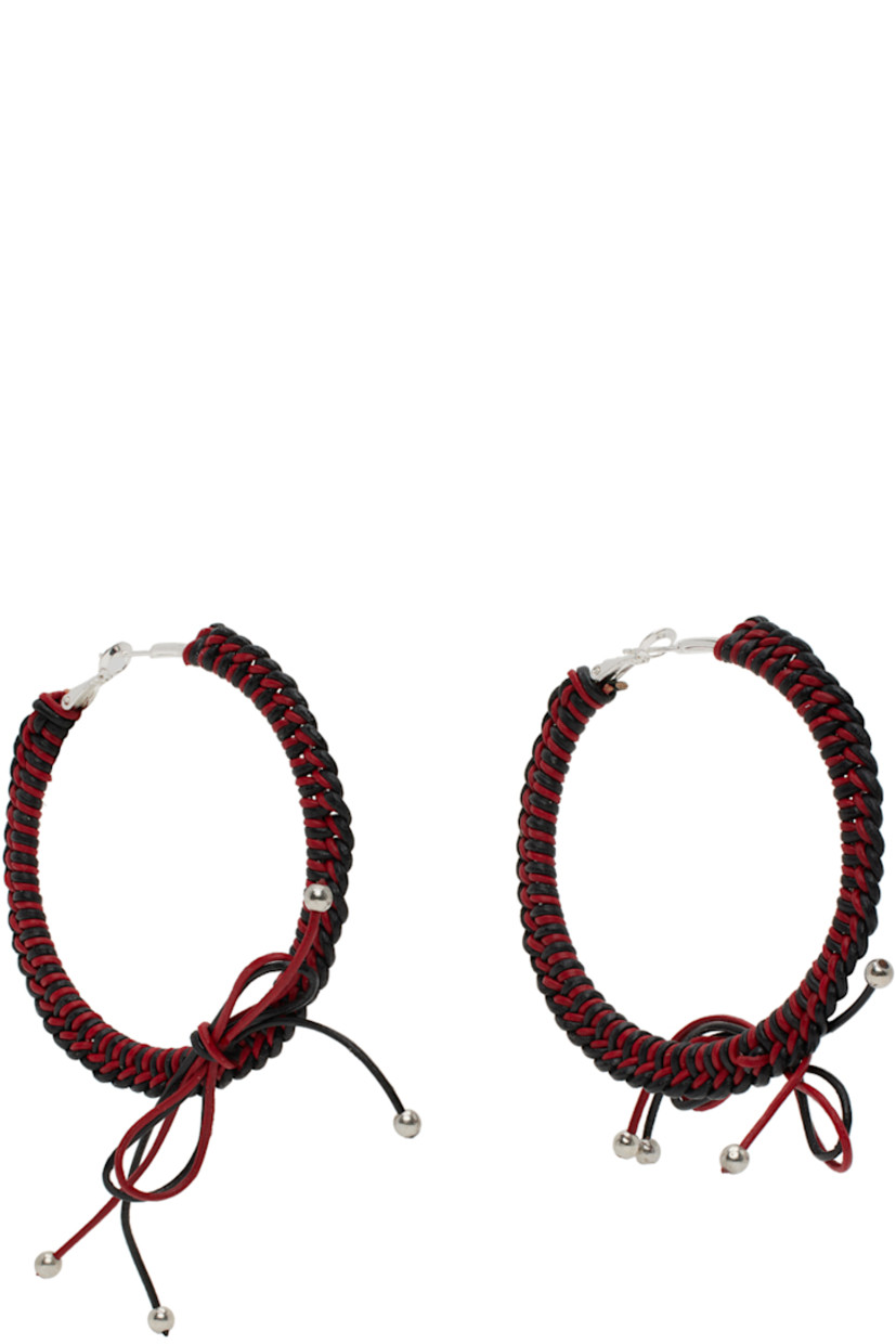 Pair of hoop earrings in sterling silver. Braided leather cord in black and red throughout.

· Bow accent at drop
· Hinged-post fastening
· D2.5"

Supplier color: Black/Red