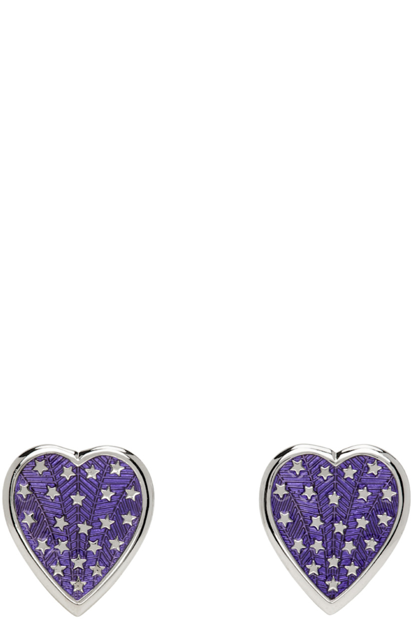 Pair of stud earrings in palladium-plated brass.

· Purple enamel and embossed graphics at face
· Post-stud fastening
· H1.25" x W1"

Supplier color: Blue