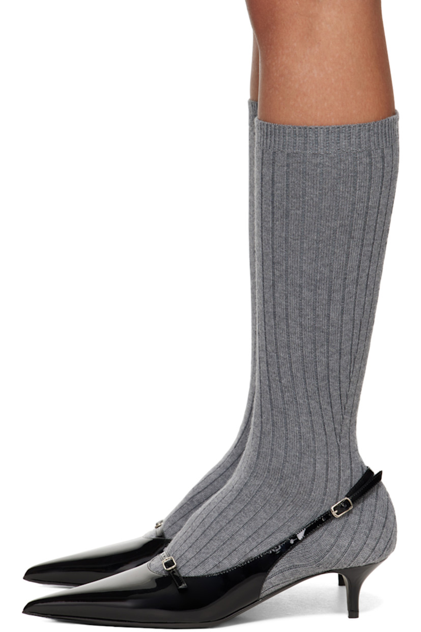 Mid-calf buffed calfskin heels in gray and black.

· Integrated sock-style rib knit wool collar
· Paneled and layered construction
· Pointed toe
· Pin-buckle strap at vamp and ankle
· Covered kitten heel with rubber injection
· Leather sole
· Heel: H2"

Supplier color: Grey