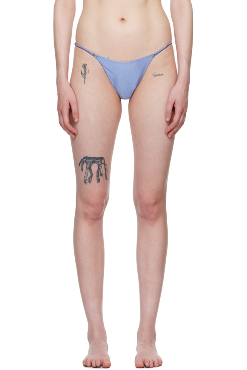 Stretch silk satin thong.

· O-rings at front
· Elasticized strap at sides
· Curb chain detailing at back
· Partial cotton jersey lining

Supplier color: Denim