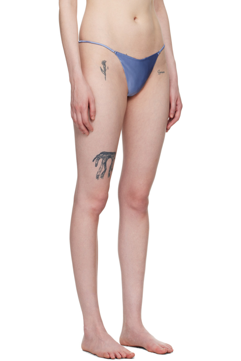 Stretch silk satin thong.

· O-rings at front
· Elasticized strap at sides
· Curb chain detailing at back
· Partial cotton jersey lining

Supplier color: Denim