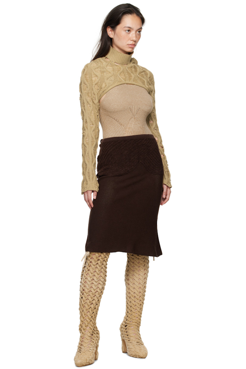 Handcrafted thigh-high cable knit boots in beige.

· Self-tie lace-up detailing throughout
· Suede lining
· Covered block heel with rubber injection
· Leather sole
· Heel: H5"

Available exclusively at SSENSE.
 
Supplier color: Sand