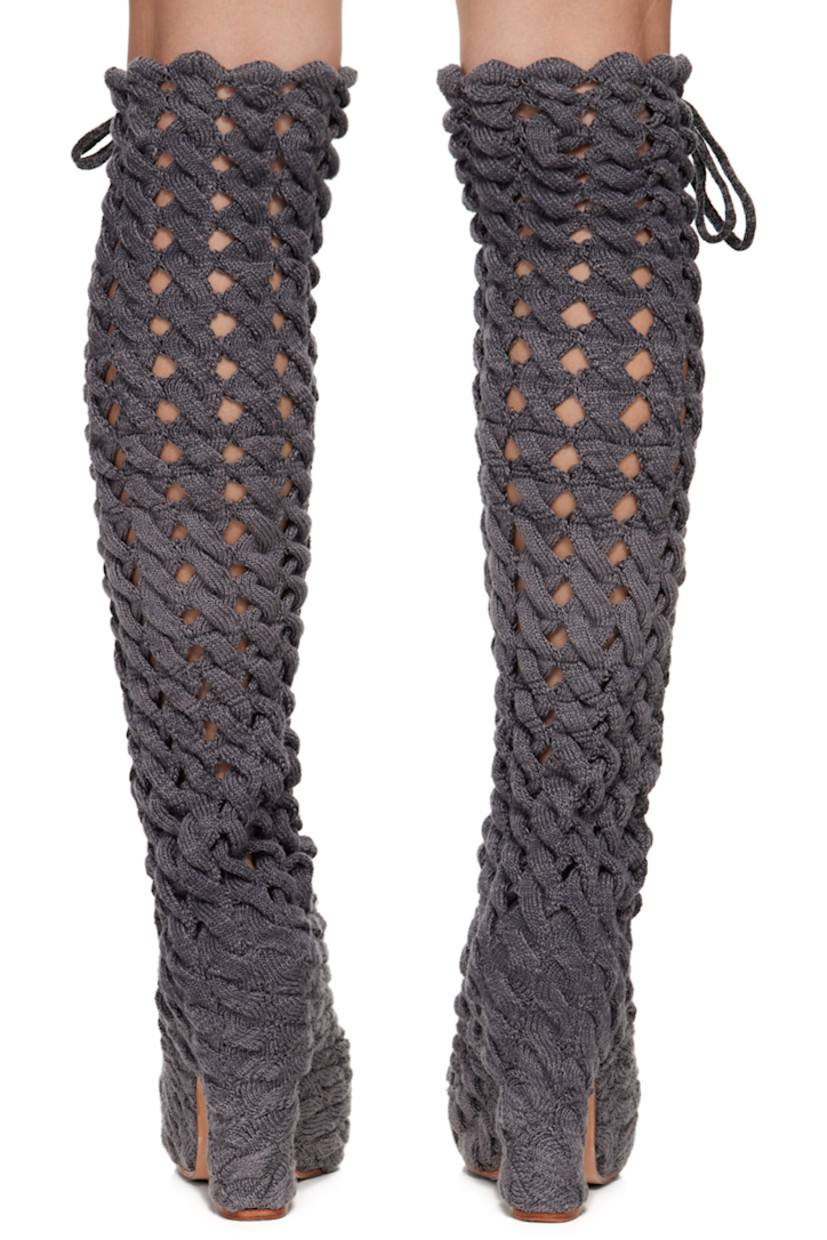 Handcrafted thigh-high cable knit boots in gray.

· Self-tie lace-up detailing throughout
· Suede lining
· Covered block heel with rubber injection
· Leather sole
· Heel: H5 in

Available exclusively at SSENSE.

Supplier color: Charcoal