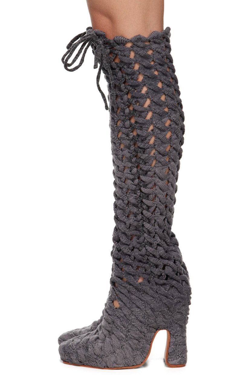 Handcrafted thigh-high cable knit boots in gray.

· Self-tie lace-up detailing throughout
· Suede lining
· Covered block heel with rubber injection
· Leather sole
· Heel: H5 in

Available exclusively at SSENSE.

Supplier color: Charcoal