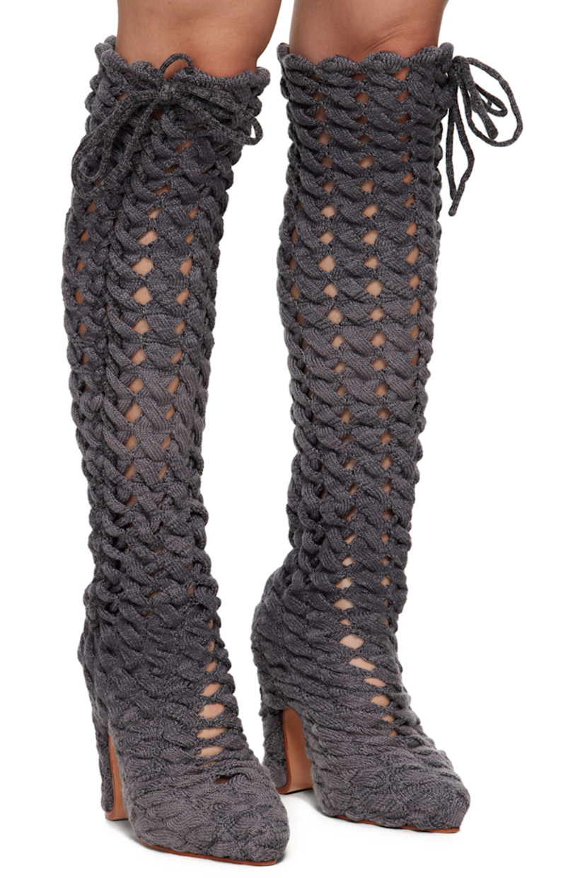 Handcrafted thigh-high cable knit boots in gray.

· Self-tie lace-up detailing throughout
· Suede lining
· Covered block heel with rubber injection
· Leather sole
· Heel: H5 in

Available exclusively at SSENSE.

Supplier color: Charcoal