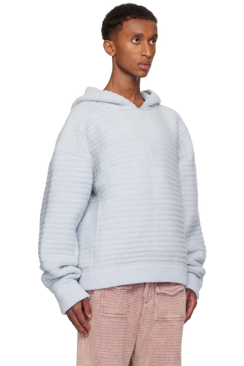 Knit stretch acrylic hoodie.

· Kangaroo pocket
· Rib-knit hem and cuffs
· Logo flag at side seam
· Dropped shoulders

Available exclusively at SSENSE.

Supplier color: Ocean