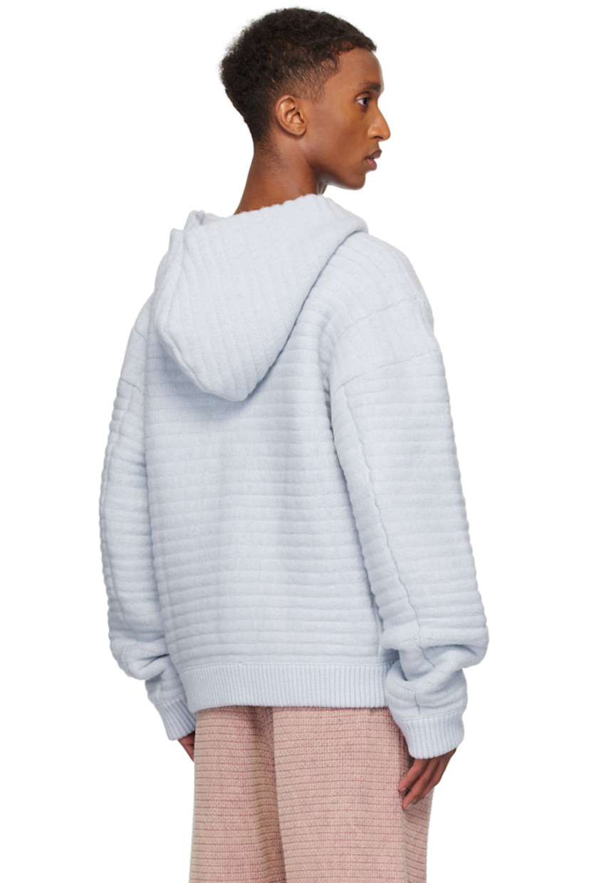 Knit stretch acrylic hoodie.

· Kangaroo pocket
· Rib-knit hem and cuffs
· Logo flag at side seam
· Dropped shoulders

Available exclusively at SSENSE.

Supplier color: Ocean