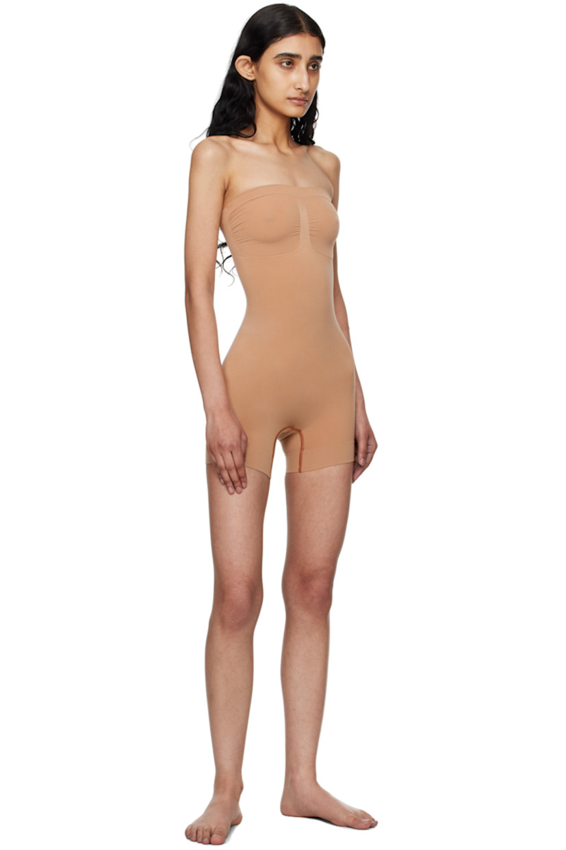 Stretch recycled nylon-blend jersey bodysuit. Includes detachable and adjustable shoulder straps for alternate styling.

· Strapless construction
· Straight neck
· Ruching at front
· Lapped gusset at bottom

Supplier color: Sienna