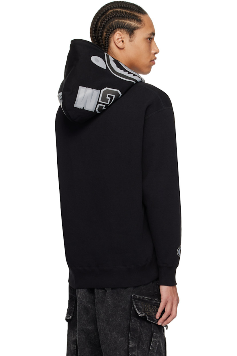 Cotton fleece hoodie. 

· Faux-leather graphic appliqués at hood and sleeve
· Two-way zip closure extends to hood 
· Embroidered logo patch at chest
· Patch pockets
· Rib-knit hem and cuffs
· Dropped shoulders
· Logo flag at cuff

Supplier color: Black