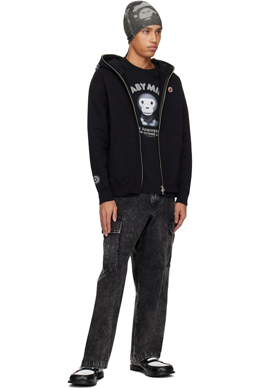 Cotton fleece hoodie. 

· Faux-leather graphic appliqués at hood and sleeve
· Two-way zip closure extends to hood 
· Embroidered logo patch at chest
· Patch pockets
· Rib-knit hem and cuffs
· Dropped shoulders
· Logo flag at cuff

Supplier color: Black
