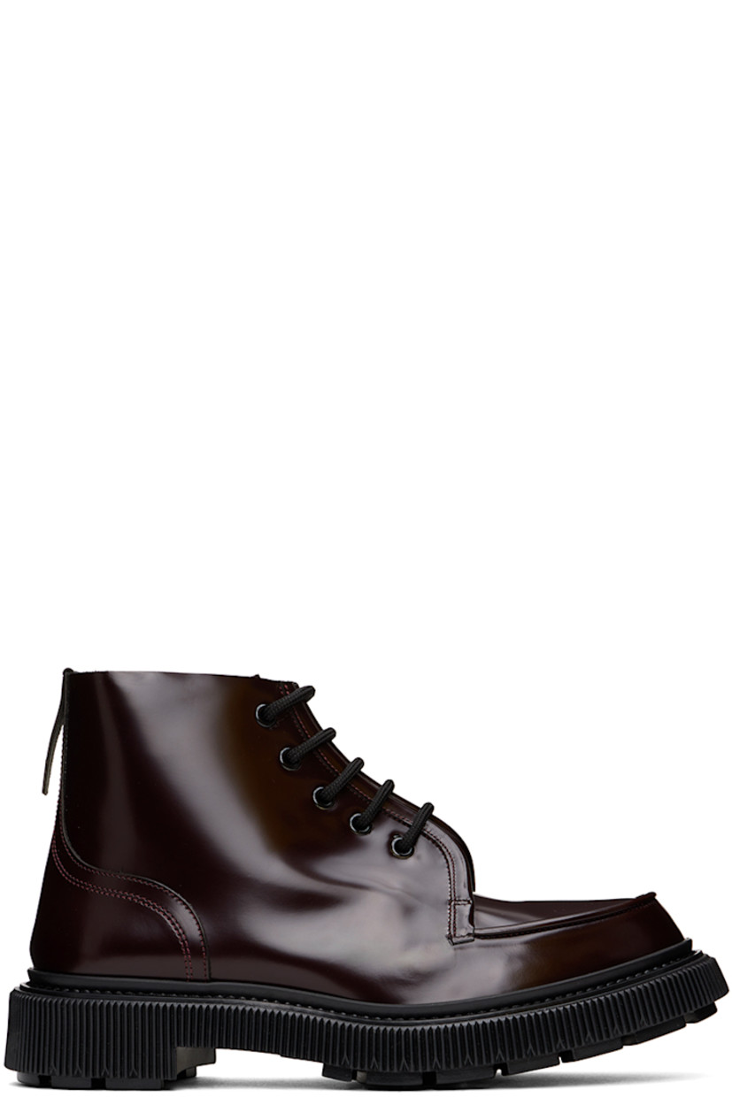 Ankle-high polished leather boots in burgundy.

· Moc toe
· Lace-up closure
· Pull-tab at heel
· Logo stamp at padded leather insole
· Buffed leather and suede lining
· Textured rubber midsole
· Injected treaded rubber sole
· Heel: H1.5"

Supplier color: Cordoban
