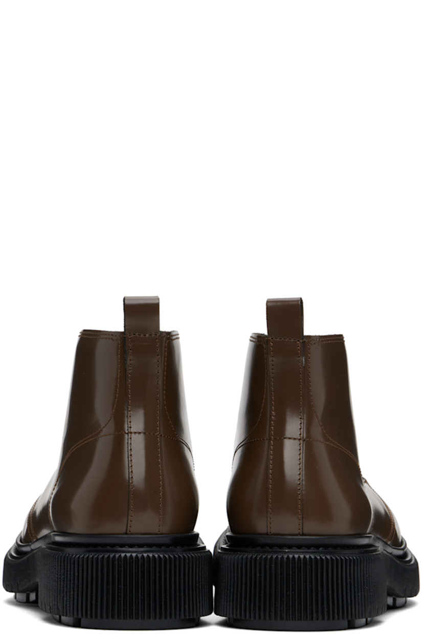 Ankle-high polished leather boots in brown.

· Lace-up closure
· Pull-loop at heel collar
· Suede lining
· Textured rubber midsole
· Treaded rubber sole
· Heel: H1.5" 

Supplier color: Earth
