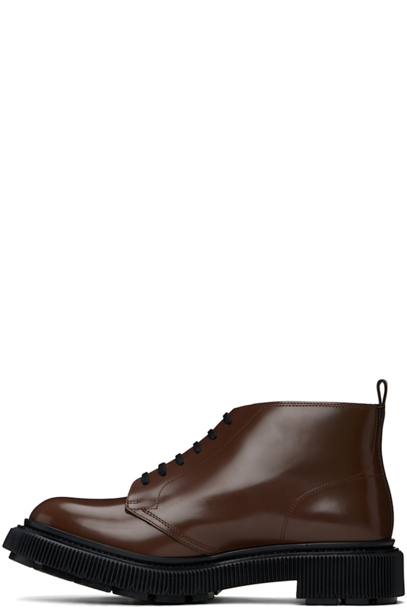 Ankle-high polished leather boots in brown.

· Lace-up closure
· Pull-loop at heel collar
· Suede lining
· Textured rubber midsole
· Treaded rubber sole
· Heel: H1.5" 

Supplier color: Earth