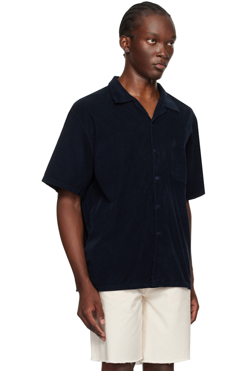 Relaxed-fit cotton corduroy shirt. 

· Open spread collar 
· Button closure
· Patch pocket at chest
· Corozo hardware 

Supplier color: Navy