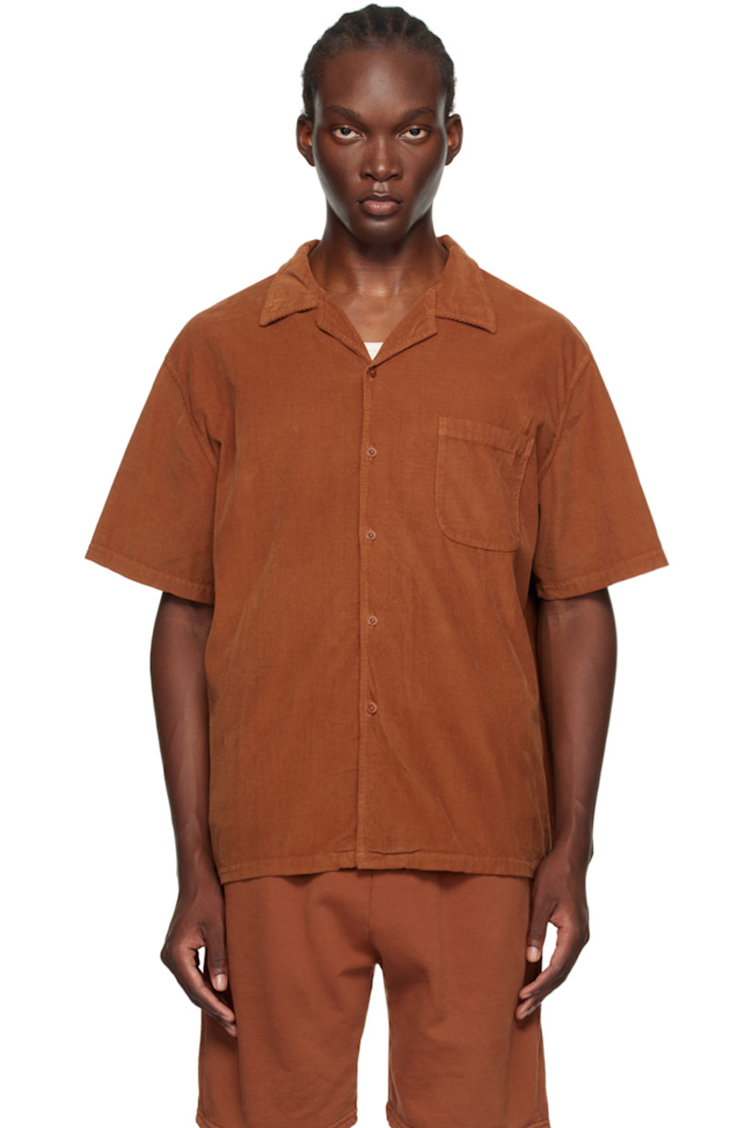 Relaxed-fit cotton corduroy shirt. 

· Open spread collar 
· Button closure
· Patch pocket at chest
· Corozo hardware 

Supplier color: Cedar