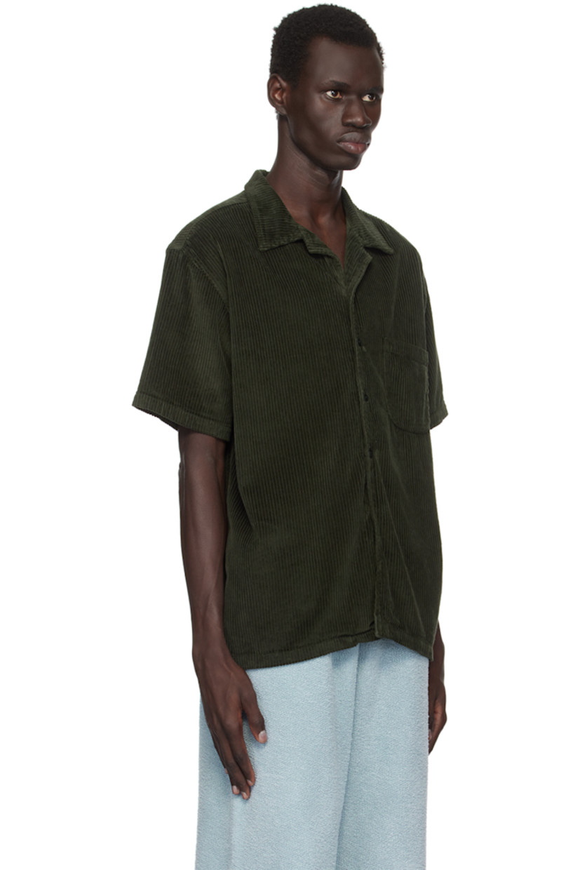 Relaxed-fit wide wale cotton corduroy shirt.

· Open spread collar
· Button closure
· Patch pocket
· Dropped shoulders
· Corozo hardware

Supplier color: Forest