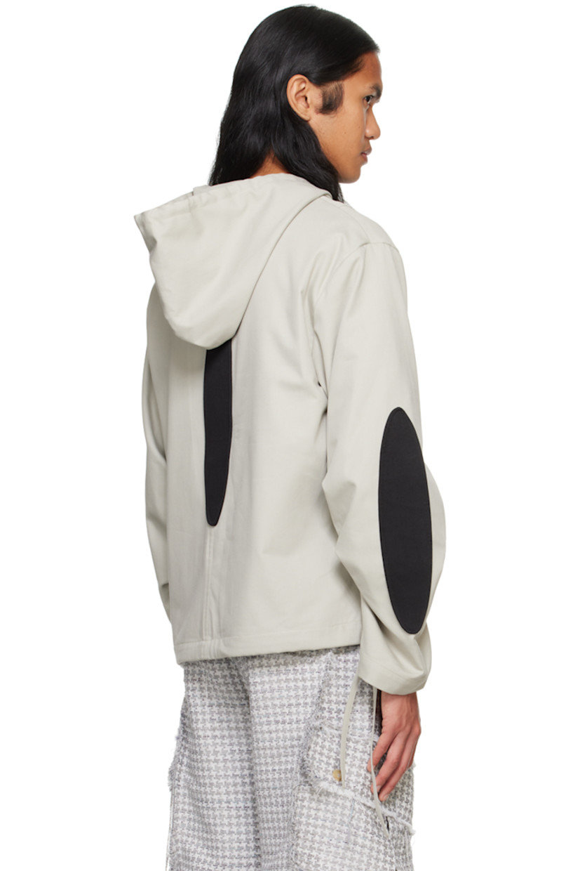 Coated cotton canvas jacket. Cotton twill graphic appliqués throughout.

· Drawstring at hood and hem
· Seam pockets
· Dropped shoulders
· Gathering at sleeves
· Fully lined

Supplier color: Grey/Black
