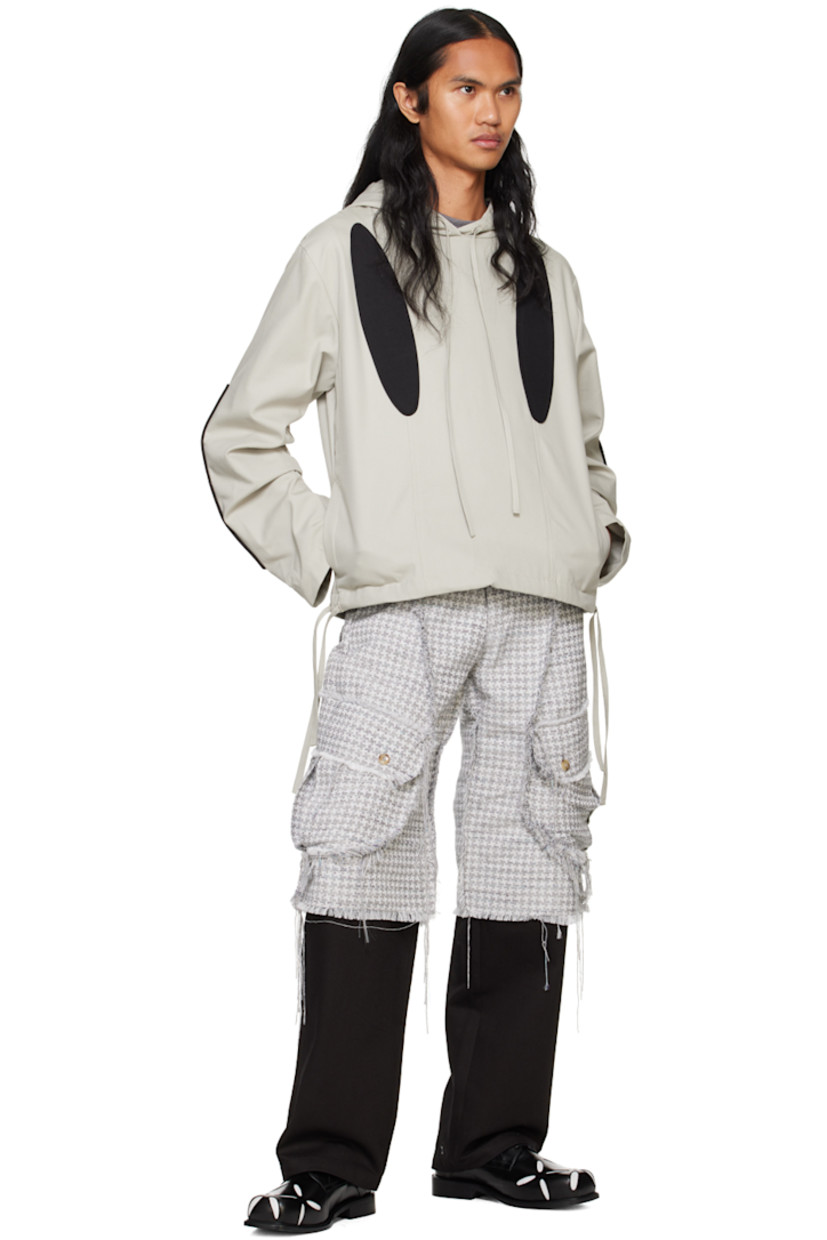 Coated cotton canvas jacket. Cotton twill graphic appliqués throughout.

· Drawstring at hood and hem
· Seam pockets
· Dropped shoulders
· Gathering at sleeves
· Fully lined

Supplier color: Grey/Black