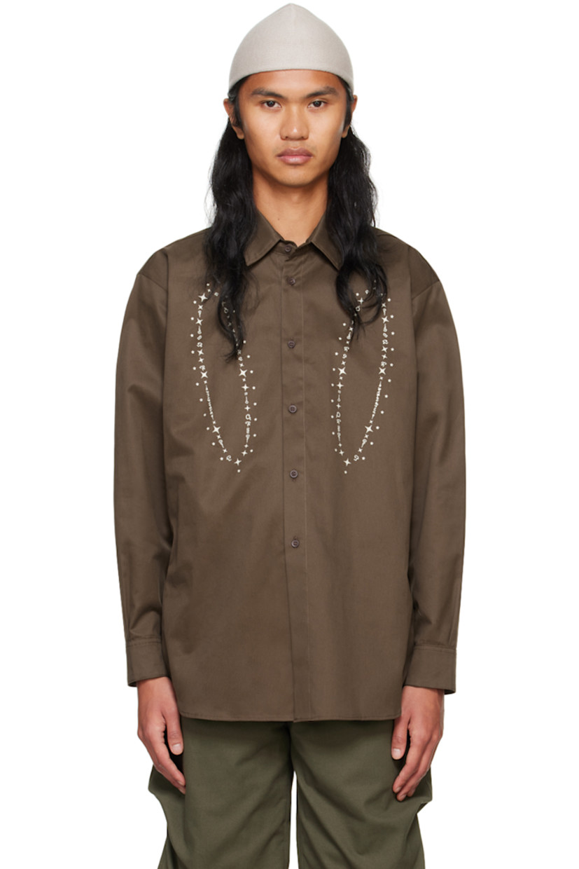 Cotton sateen shirt.

· Spread collar
· Button closure
· Graphic printed at front
· Droptail hem
· Pleated single-button barrel cuffs
· Box pleat at back yoke

Supplier color: Brown