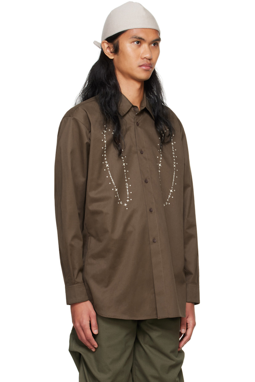 Cotton sateen shirt.

· Spread collar
· Button closure
· Graphic printed at front
· Droptail hem
· Pleated single-button barrel cuffs
· Box pleat at back yoke

Supplier color: Brown