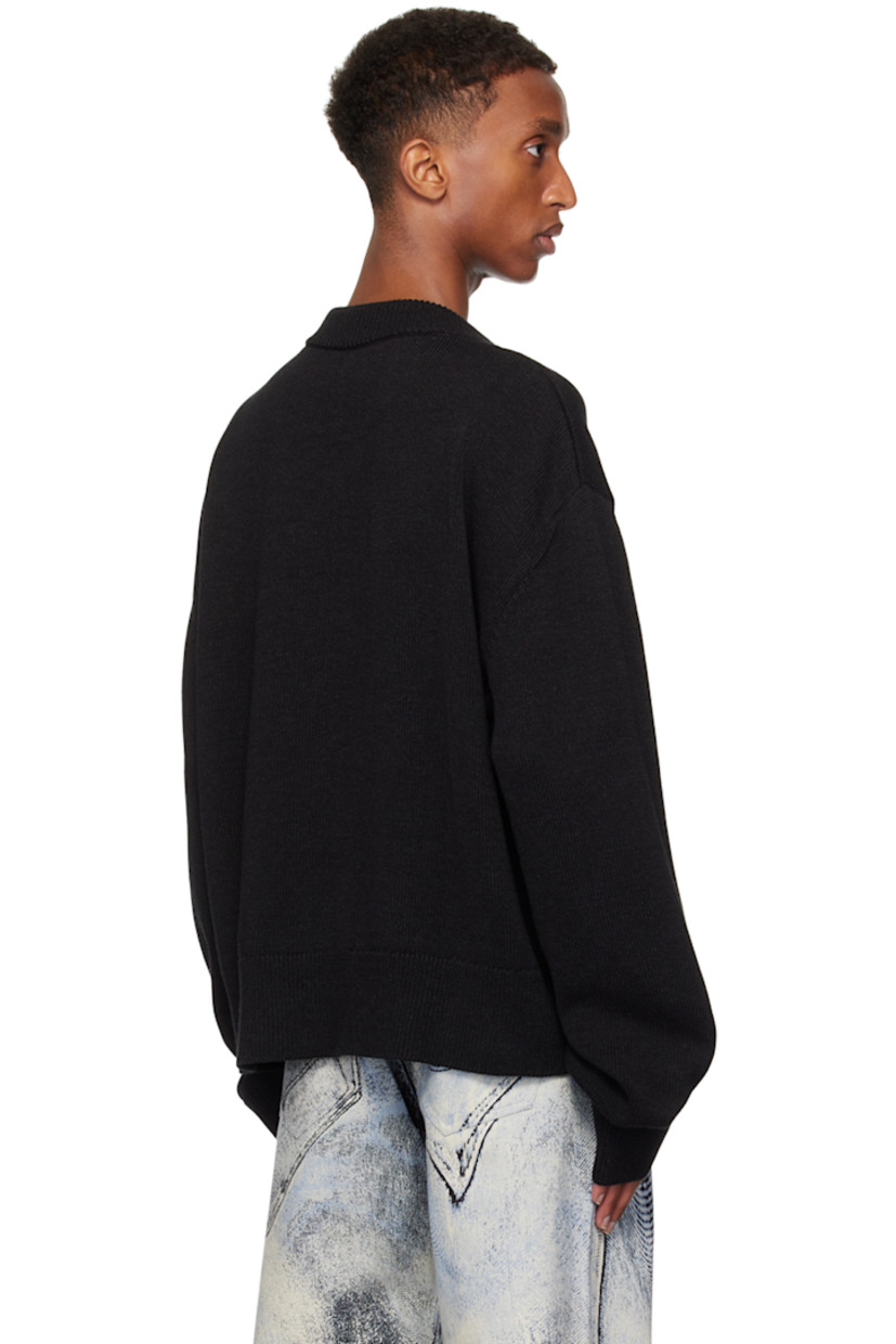 Boxy-fit knit cotton sweater.

· Rib knit crewneck, hem, and cuffs
· Slit at collar

Supplier color: Black